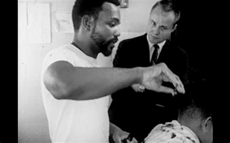 Pastor Youngdahl speaking with a young barber, Ernie Chambers. "A Time For Burning", 1966. Click to be taken to the full transcript.